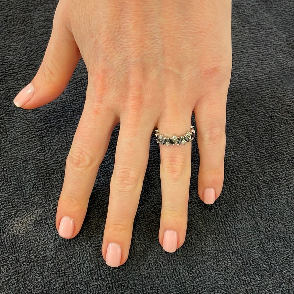 ETERNITY BAND in silver setting has black onyx and cubic stones.